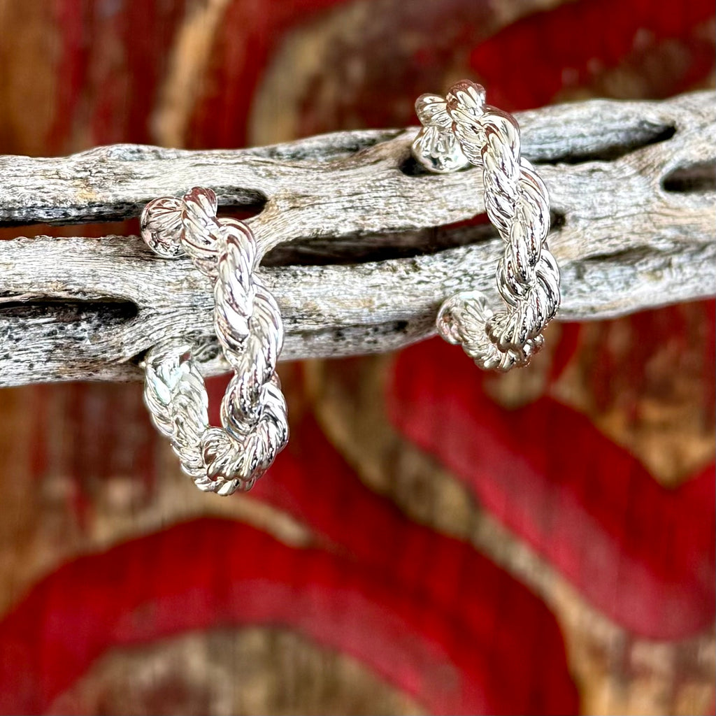 Women's Montana Silversmiths silver braid hoop earrings in silver, twisted rope-inspired braid design adds texture and dimension, with lightweight hoop construction for comfortable all-day wear - ER6445. Available at Blair's Western Wear, Marble Falls, TX.