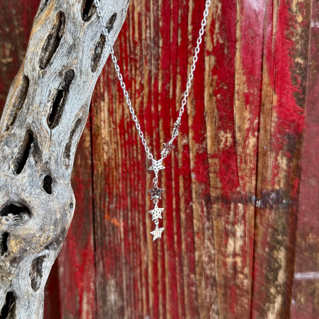 Women’s Montana Silversmiths Silver Star CZ necklace with cascading star pendant, featuring sparkling cubic zirconia accents, with a lightweight comfortable chain - NC5785. Available at Blair's Western Wear, Marble Falls, TX.
