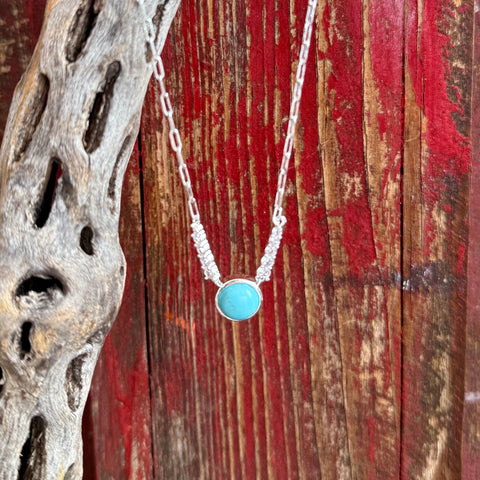 Women’s Montana Silversmiths silver necklace with round turquoise stone pendant in turquoise, genuine turquoise center stone offers a bold pop of classic Western color, with link chain design provides durability and a balanced drape - NC6482. Available at Blair's Western Wear, Marble Falls, TX.