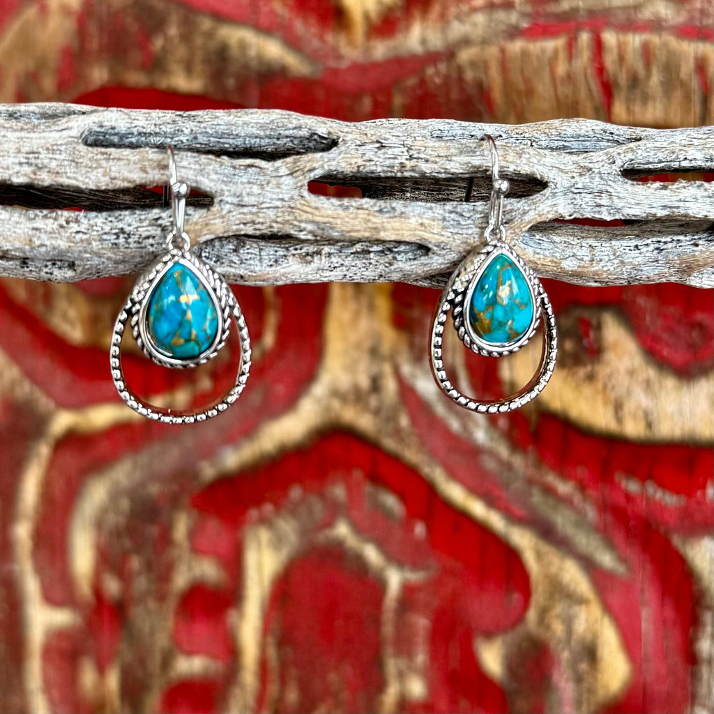 Women’s Montana Silversmiths turquoise rope teardrop earrings in silver, featuring genuine turquoise stones, with a double-teardrop rope design for added dimension – ER4376TQ. Available at Blair's Western Wear, Marble Falls, TX.