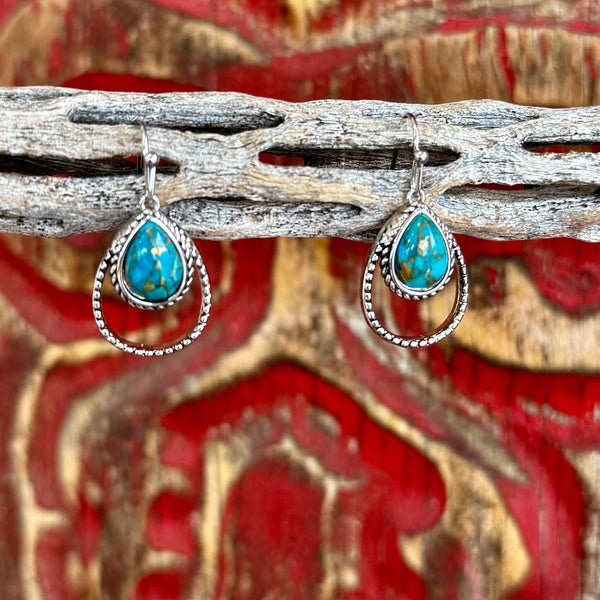 Women’s Montana Silversmiths turquoise rope teardrop earrings in silver, featuring genuine turquoise stones, with a double-teardrop rope design for added dimension – ER4376TQ. Available at Blair's Western Wear, Marble Falls, TX.