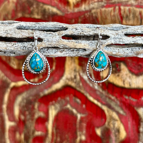 Women’s Montana Silversmiths turquoise rope teardrop earrings in silver, featuring genuine turquoise stones, with a double-teardrop rope design for added dimension – ER4376TQ. Available at Blair's Western Wear, Marble Falls, TX.