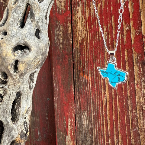 Women’s Montana Silversmiths necklace featuring a Texas-shaped turquoise pendant in silver, crafted with genuine veined turquoise, and set on an adjustable silver chain – NC6322. Available at Blair’s Western Wear, Marble Falls, TX.