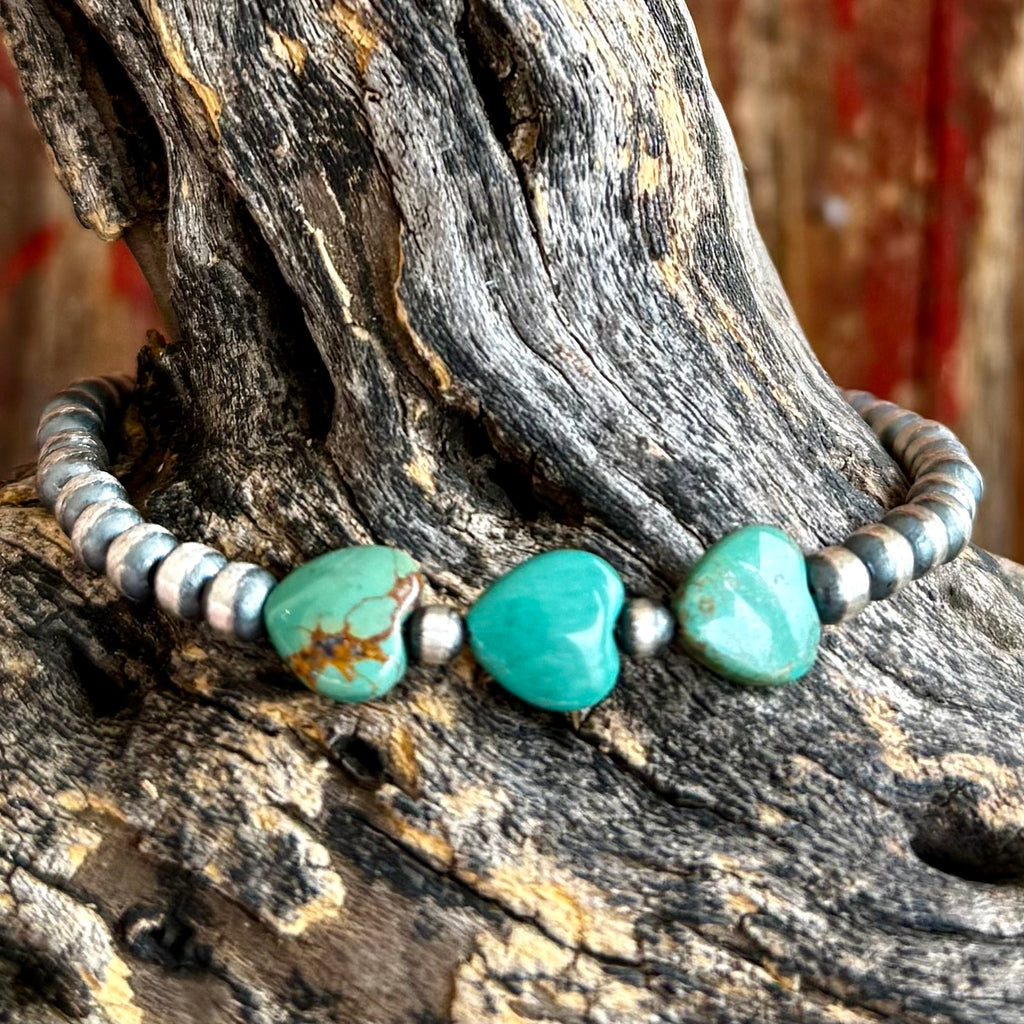 Women's Nizhoni Traders Bracelet Heart Turquoise Beaded Bracelet in Turquoise, handcrafted with genuine turquoise heart stones that add vibrant color, with 4mm sterling silver pearl beads that create classic Southwestern style - NZBRHRTBEAD. Available at Blair's Western Wear, Marble Falls, TX.