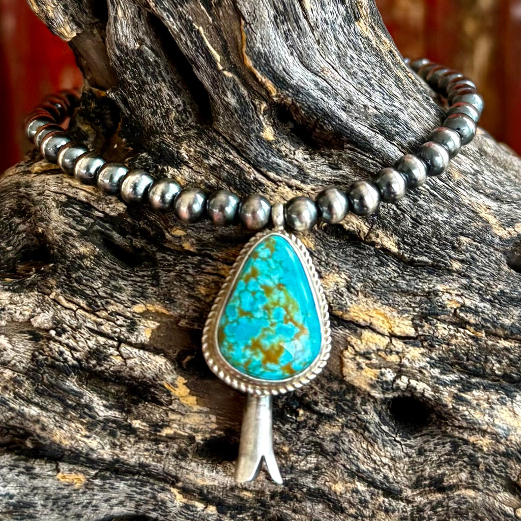 Women's Nizhoni Traders Bracelet Stretch Bracelet in Turquoise, genuine turquoise droplet centerpiece set in sterling silver, with 3mm sterling silver pearl beads for a classic Navajo-inspired look - NZBRDROPLET. Available at Blair's Western Wear, Marble Falls, TX.