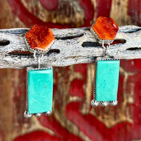 Women's Nizhoni Traders dangle sterling silver earrings in turquoise and orange, crafted from sterling silver for lasting durability, with genuine Kingman turquoise rectangular drops and vibrant spiny oyster hexagon tops - NKERDANG. Available at Blair's Western Wear, Marble Falls, TX.