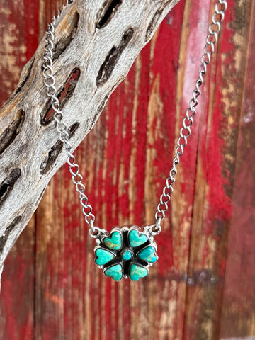 Women's Nizhoni Traders Necklace Heart Cluster Pendant in Turquoise, genuine Kingman turquoise heart stones arranged in a clover-style cluster, with handcrafted sterling silver setting highlighting Southwestern artistry - NZNKHRTCON. Available at Blair's Western Wear, Marble Falls, TX.
