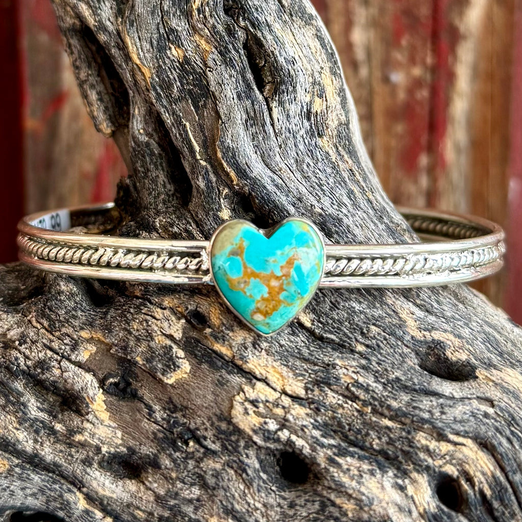 Women's Nizhoni Traders cuff bracelet featuring Sonoran Mountain turquoise heart in sterling silver, genuine turquoise stone with natural matrix, with rope-detailed sterling silver band - NZCUFFHRT. Available at Blair's Western Wear, Marble Falls, TX.