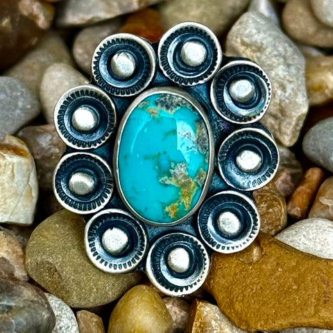 Women's Nizhoni Traders Turquoise Sterling Silver Flower Ring in Blue, Emerald Valley turquoise centerpiece with natural matrix, with handcrafted sterling silver floral cluster design - NZRNFLW. Available at Blair's Western Wear, Marble Falls, TX.