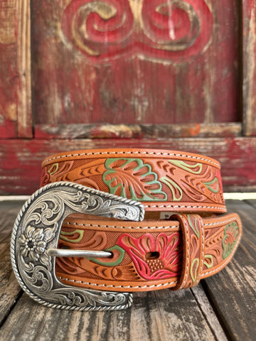Natural tan tooled leather with hand-painted coral flowers and sage green leaves — a beautifully crafted western belt with cream stitched edges. Available at Blair's Western Wear located in Marble Falls, TX.