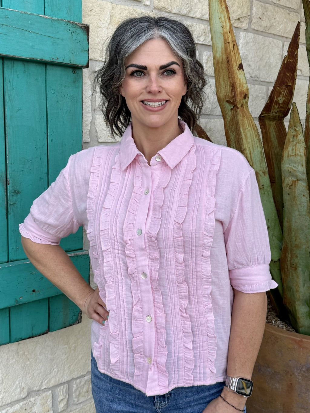 Pink women's ruffle button-up blouse with vertical front detailing, structured collar, and short puff sleeves — Blair's Western Wear Marble Falls TX