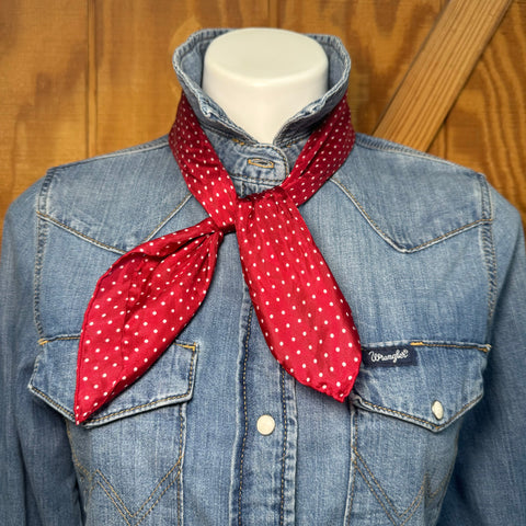 A little silk goes a long way. This red and white polka dot wildrag is the kind of finishing touch that pulls a whole outfit together — whether you're tying it at the neck, wrapping it in your hair, or tucking it into a jacket for a pop of Western charm.