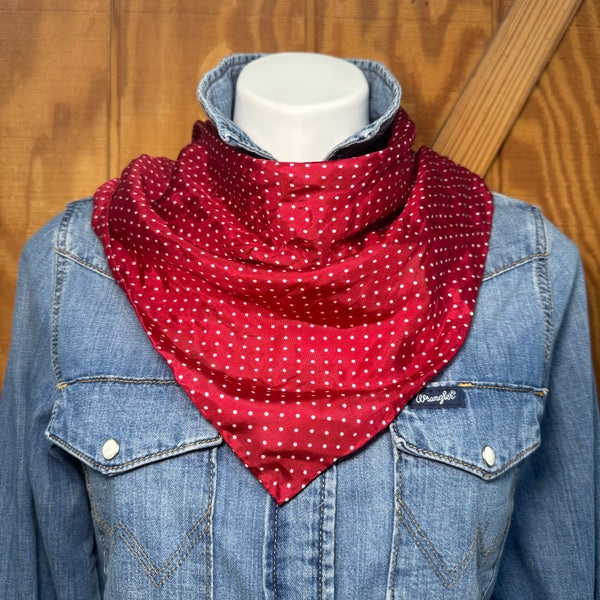 A little silk goes a long way. This red and white polka dot wildrag is the kind of finishing touch that pulls a whole outfit together — whether you're tying it at the neck, wrapping it in your hair, or tucking it into a jacket for a pop of Western charm.