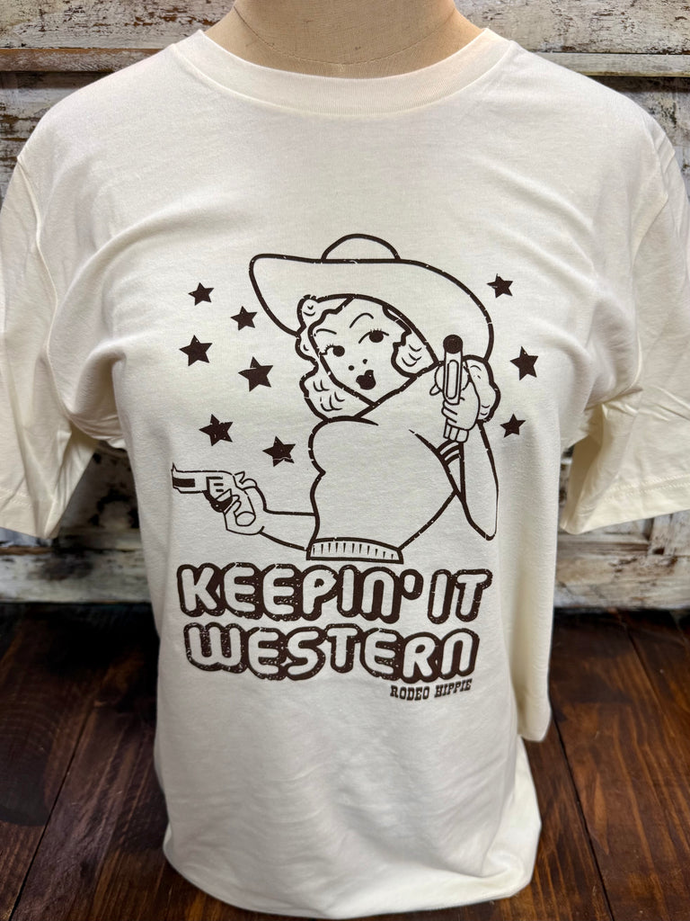 Women’s Rodeo Hippie short sleeve graphic tee pistol cowgirl in natural, soft breathable cotton-blend fabric, with vintage-inspired Keepin’ It Western graphic for everyday comfort - KEEP WSTRN. Available at Blair's Western Wear, Marble Falls, TX.