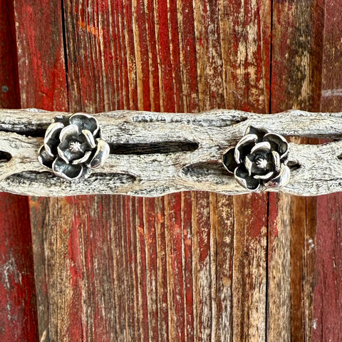 Women’s silver rose stud earring with a sculpted floral design, lightweight for all-day comfort, and finished with a secure post-and-back closure – T1523. Available at Blair’s Western Wear, Marble Falls, TX.