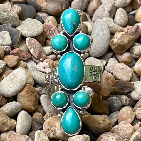 Women's Silver Star Jewelry Turquoise Cluster Adjustable Ring in Sterling Silver, set with seven genuine turquoise stones, with a hand-stamped floral double band for comfort and style - STARRNCLUST. Available at Blair's Western Wear, Marble Falls, TX.