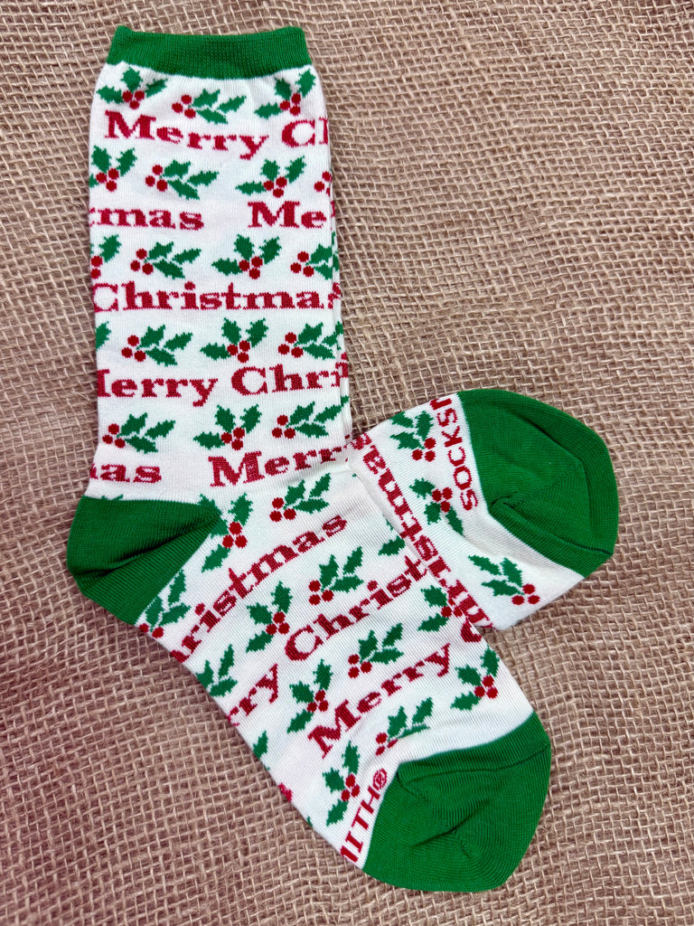 Women’s Socksmith graphic cotton crew Merry Christmas socks in ivory, with festive holly berry design, reinforced heel and toe, and soft cotton blend comfort - WNC3113. Available at Blair's Western Wear, Marble Falls, TX.
