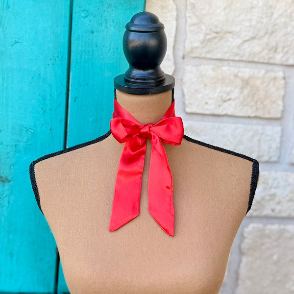 A bright red satin neck scarf 