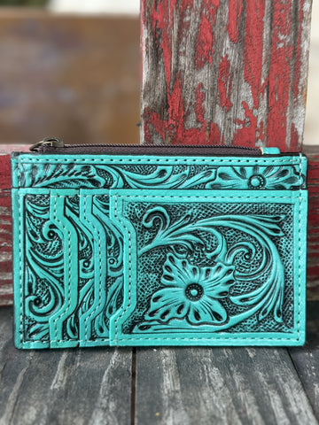  ADBG1506I — Women's vibrant turquoise hand-tooled leather cardholder wallet showing large floral and scroll motif with dark black antiqued contrast on the front, three fanned card slots on the left panel, and zippered top pouch — Blair's Western Wear Marble Falls TX