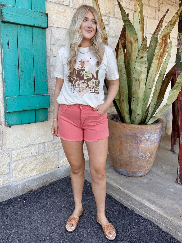 Women’s Wrangler denim jean shorts in pink, featuring a flattering mid-rise fit with frayed hem detail - Wrangler 112373356. Available at Blair's Western Wear, Marble Falls, TX.