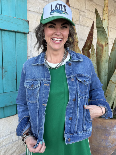 Women’s Wrangler denim trucker jacket in medium wash, classic button-front design with chest pockets - Wrangler 112373778. Available at Blair's Western Wear, Marble Falls, TX.