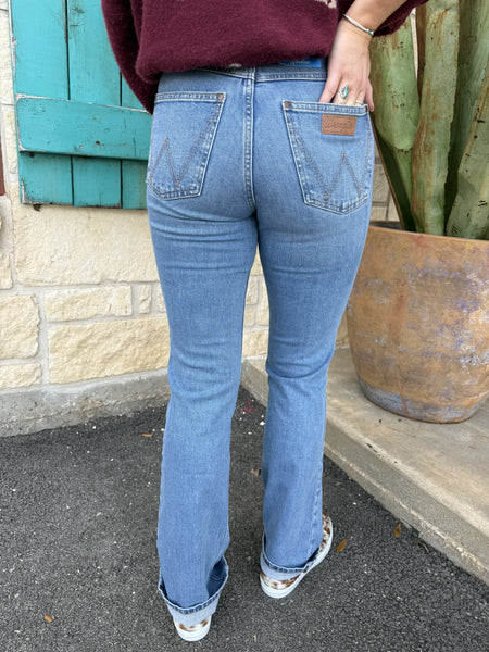 Women’s Wrangler Jeans Bootcut in medium wash, mid-rise fit with classic bootcut leg opening - 112367598. Available at Blair's Western Wear, Marble Falls, TX.