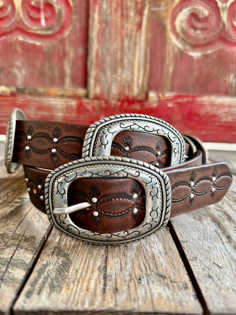 Women’s Wrangler Western Concho Leather Belt in Brown, genuine leather construction designed for durability and flexibility, with decorative engraved silver-tone conchos and detailed Western tooling - 7909390BW. Available at Blair's Western Wear, Marble Falls, TX.