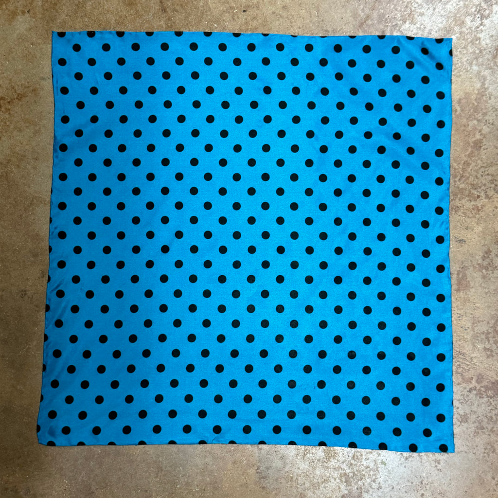 Wyoming Traders Wildrag Polka Dot scarf in aqua with black dots, made from lightweight satin fabric, featuring a classic 34-inch square design and smooth finish - SCAQ. Available at Blair's Western Wear, Marble Falls, TX.