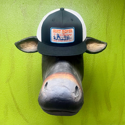 Youth Red Dirt Hat Co. Trucker Cap in Black/White, lightweight mesh back for ventilation, with embroidered “Goat Roper In Training” patch for standout style - RDHCY-27. Available at Blair's Western Wear, Marble Falls, TX.