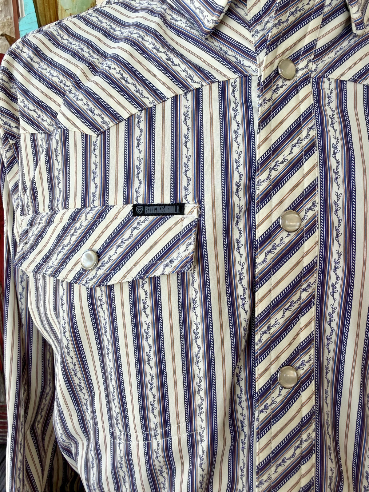 Close-up of natural and blue vine-striped shirt showing diagonal-striped yoke, placket and pocket flap with pearl-style snaps — Blair's Western Wear Marble Falls TX