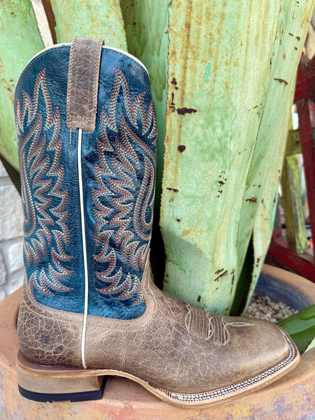 Men’s Ariat Cowboy Boot Earth Brown Bison/Royal Blue, built from bison leather for long-term durability, with TekStep cushioning for all-day comfort – 10063779. Available at Blair's Western Wear, Marble Falls, TX.