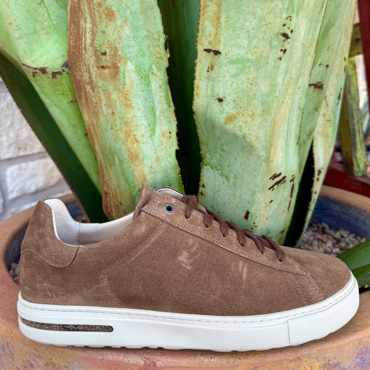 Men’s Birkenstock Sneaker in Dark Tea Suede, made with rich suede that conforms to your foot, with a removable cork-latex footbed that cushions and supports – 1030130. Available at Blair's Western Wear, Marble Falls, TX.
