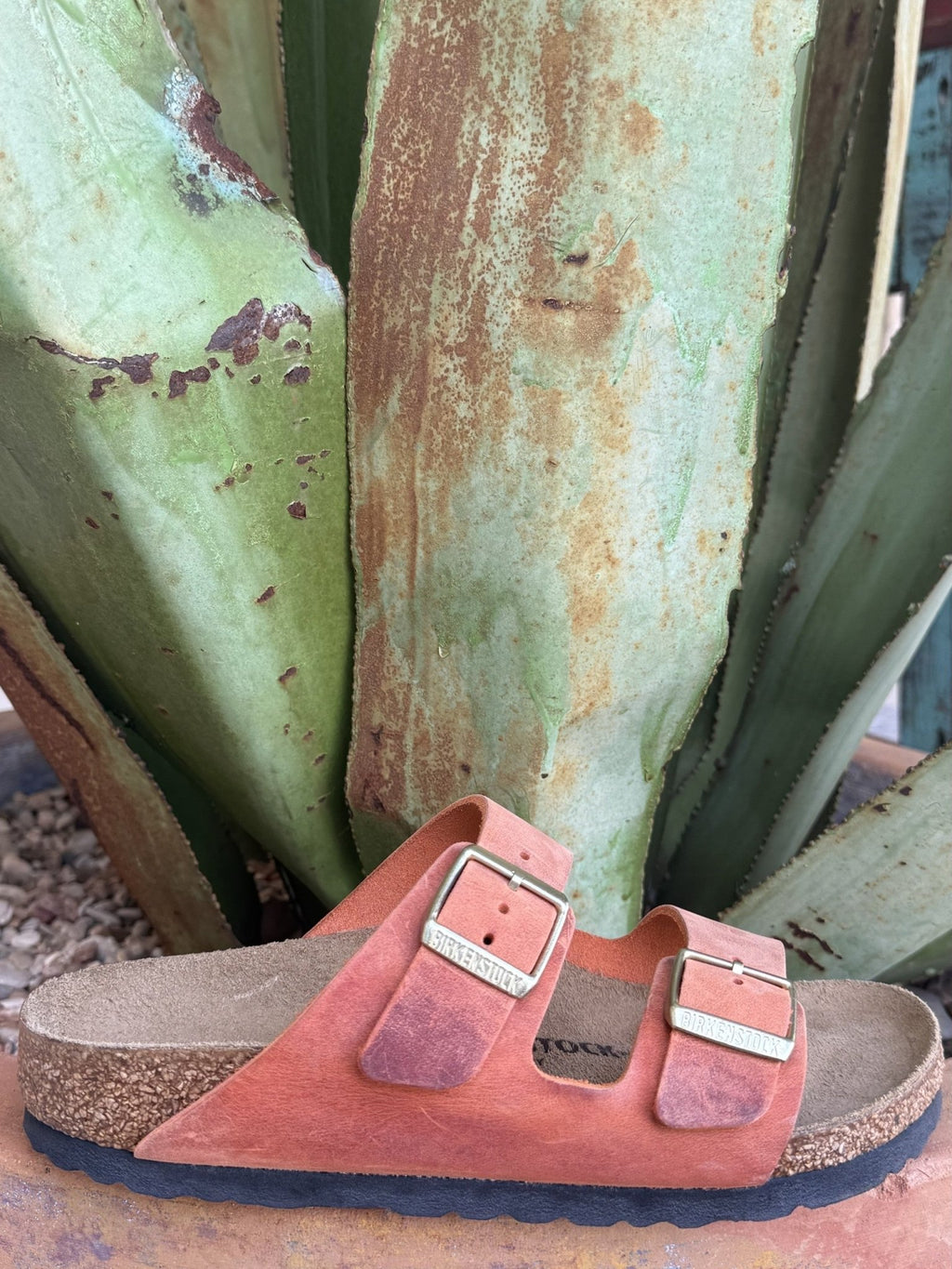 Women's burnt-orange oiled leather two-strap sandal with adjustable metal buckles and a cushioned cork footbed — Blair's Western Wear Marble Falls TX⠋