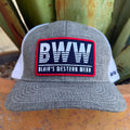 A heather gray and white trucker hat with a prominent rectangular patch on the front that reads 'BWW BLAIR'S WESTERN WEAR'. 