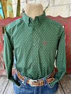 Men's hunter green long sleeve shirt with small white and pink diamond print, button-down collar, green buttons, and chest pocket with pink embroidered logo — Blair's Western Wear Marble Falls TX