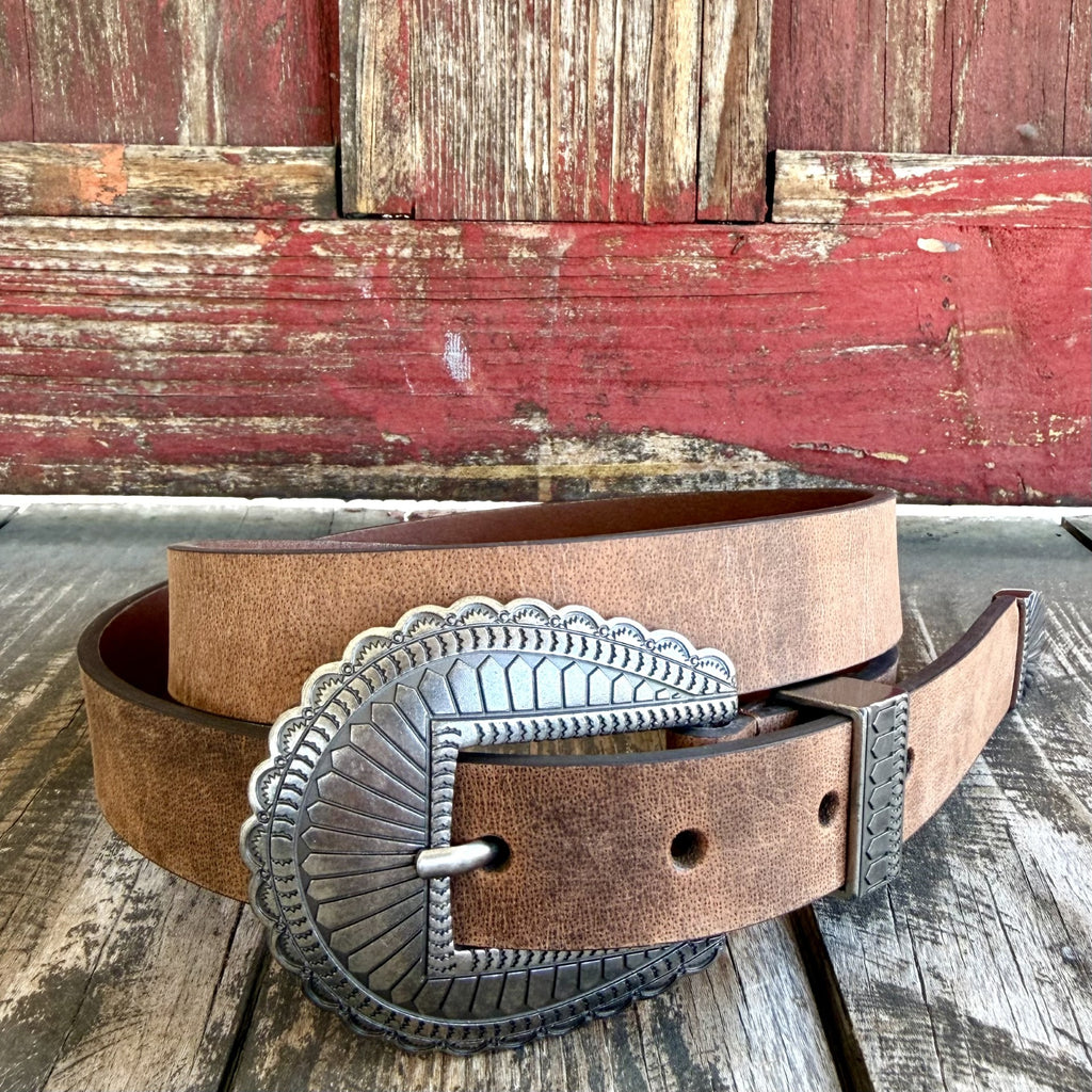 Women's narrow tan Western belt with scalloped silver-tone engraved buckle, matching metal keeper and decorative tip — Blair's Western Wear Marble Falls TX