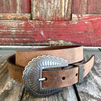 Women's narrow tan Western belt with scalloped silver-tone engraved buckle, matching metal keeper and decorative tip — Blair's Western Wear Marble Falls TX