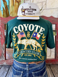 Men's hunter green Raised by Coyote Coyote Country Club short sleeve tee with gold coyote, American and Texas flags, laurel wreath back graphic and Est. 2021 banner, back view — Blair's Western Wear Marble Falls TX