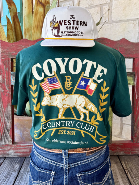 Men's hunter green Raised by Coyote Coyote Country Club short sleeve tee with gold coyote, American and Texas flags, laurel wreath back graphic and Est. 2021 banner, back view — Blair's Western Wear Marble Falls TX