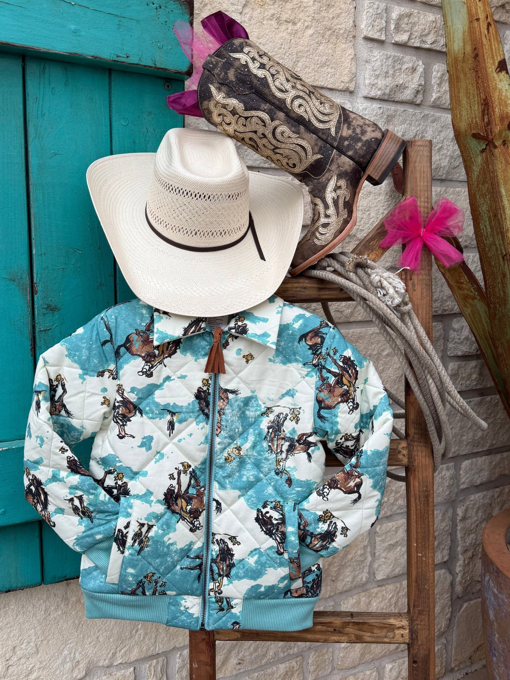Girls Cinch Western jacket in turquoise, quilted cotton construction for lightweight warmth, with rib-knit cuffs for a secure fit - CWJ8011001. Available at Blair's Western Wear, Marble Falls, TX.
