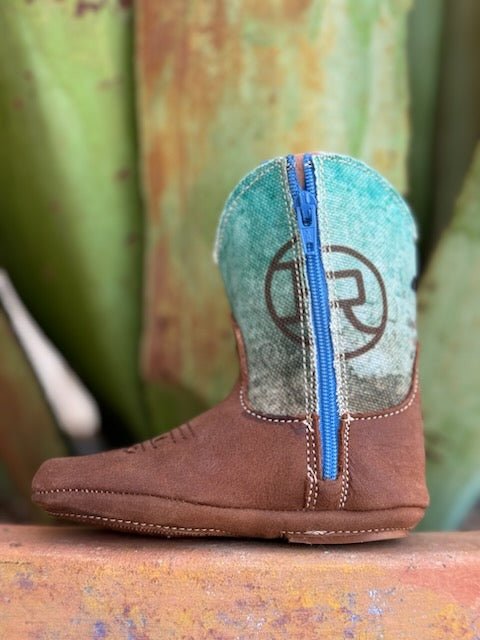 Infant Brown and Blue Boot with a graphic of a cowboy riding a bull - 91679071377 - These little boots have a zipper on the side and rubber bottom. Available at BLAIR'S Western Wear located in Marble Falls TX
