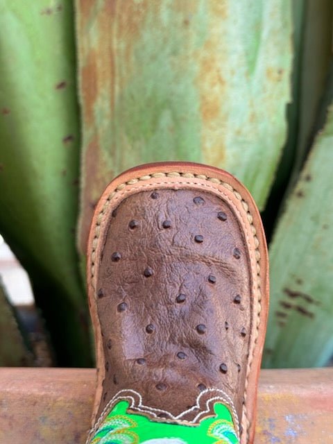 Infant Baby Roper Boot crafted from genuine leather in a classic brown hue with playful lime green accents. They feature a Velcro side closure for easy on and off. The sturdy rubber sole provides the grip and flexibility needed for those first steps.  Infant Roper Boots - 91679128247 - BLAIR'S Western Wear located in Marble Falls TX