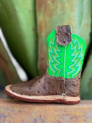 Infant Baby Roper Boot crafted from genuine leather in a classic brown hue with playful lime green accents. They feature a Velcro side closure for easy on and off. The sturdy rubber sole provides the grip and flexibility needed for those first steps.  Infant Roper Boots - 91679128247 - BLAIR'S Western Wear located in Marble Falls TX