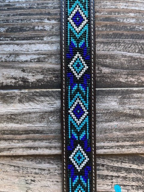 Kids Aztec Beaded Tooled Leather Belt -  XIBB101K - This kid's western belt pairs genuine hand-tooled leather with a bold Aztec-inspired beaded inlay in cobalt blue, turquoise, and white — finished with a classic engraved silver buckle. Available at Blair's Western Wear located in Marble Falls TX 