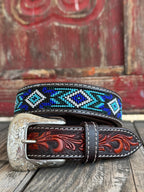 Kids Aztec Beaded Tooled Leather Belt -  XIBB101K - This kid's western belt pairs genuine hand-tooled leather with a bold Aztec-inspired beaded inlay in cobalt blue, turquoise, and white — finished with a classic engraved silver buckle. Available at Blair's Western Wear located in Marble Falls TX 