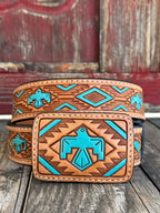 Rich tan tooled leather meets a painted turquoise Aztec-inspired bird design; — a bold, color-forward western belt with deep southwestern character that turns heads from across the room. The intricate tooling and vivid turquoise tones bring a heritage-inspired artistry to everyday western style, making this belt as much a statement piece as it is a wardrobe staple.