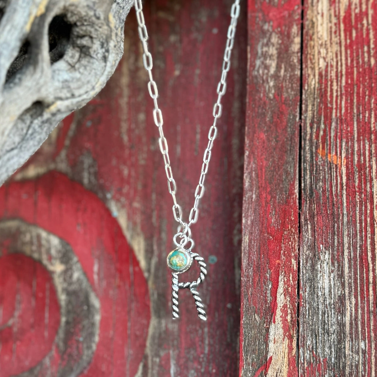 Women's Boho Sol Necklace Roper Letter Turquoise Charm in Silver, crafted with a vibrant natural turquoise stone, with a sturdy silver-toned chain and Western rope-style letter pendant - T3121. Available at Blair's Western Wear, Marble Falls, TX.