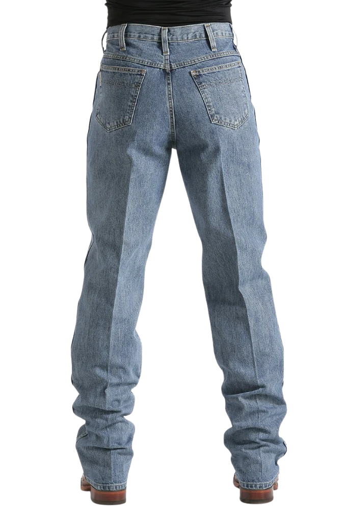 Rear view of a person wearing light blue straight-leg denim jeans with a black top and brown shoes, shown against a plain white background.