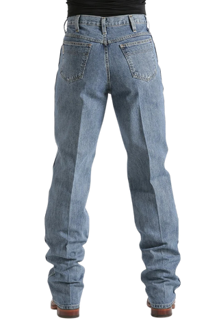Rear view of a person wearing light blue straight-leg denim jeans with a black top and brown shoes, shown against a plain white background.