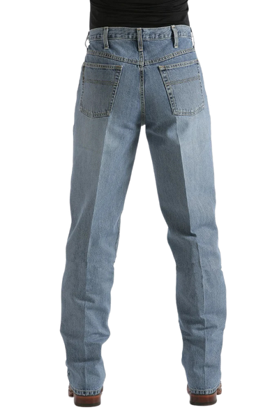 Rear view of a person wearing light blue denim jeans with a black top and brown shoes, shown against a plain white background.